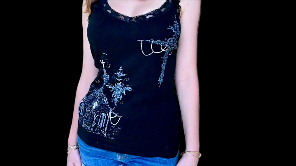 A hand painted lace tank top with a church and cross design.