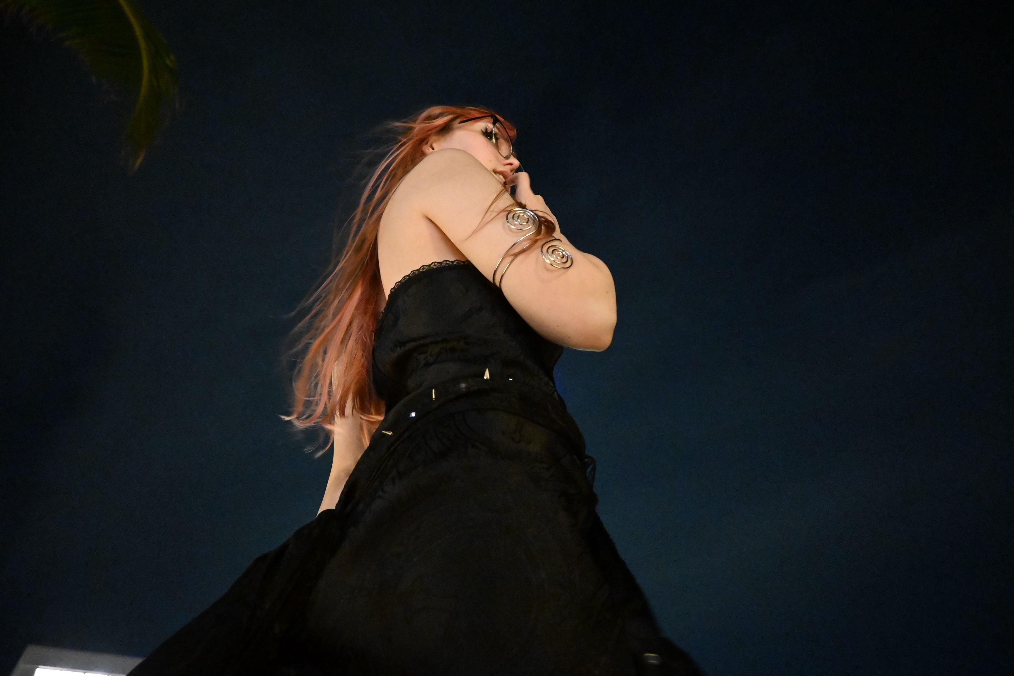 woman in black dress at night